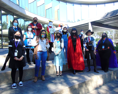 CyraCom employees pose in costumes for Halloween