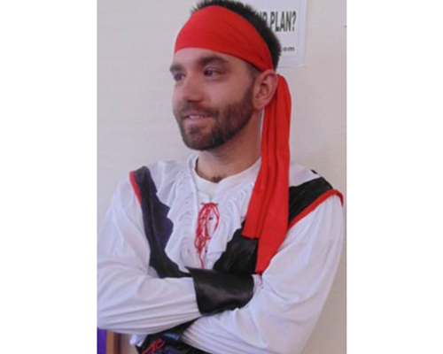 CyraCom employee in pirate Halloween costume