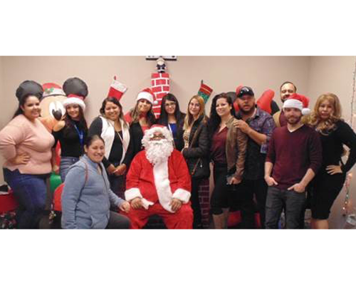 CyraCom Las Cruces Center employees in Holiday outfits