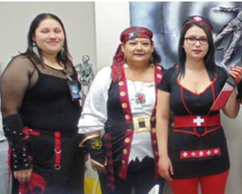 CyraCom employees in Halloween costumes (Las Cruces Center)