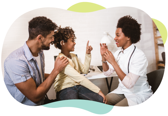 parents teaching child sign language