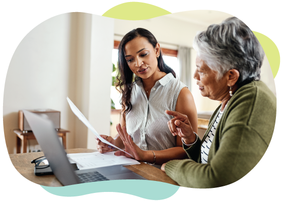 young woman explains paperwork to grandmother