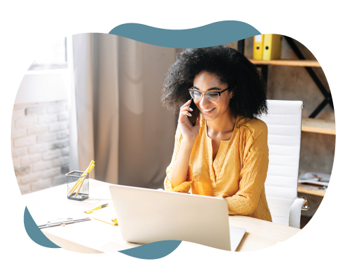 woman talking on cell phone at her desk