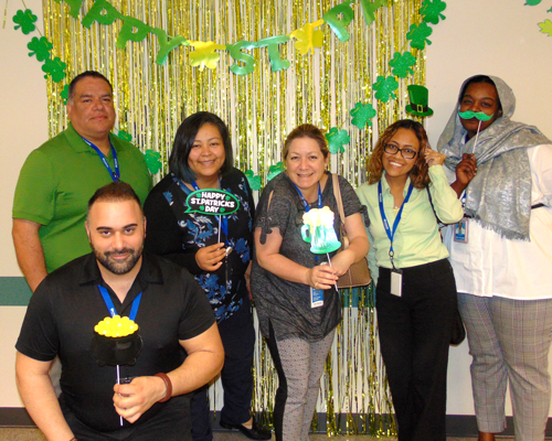CyraCom Houston Center employees celebrating St. Patrick's Day