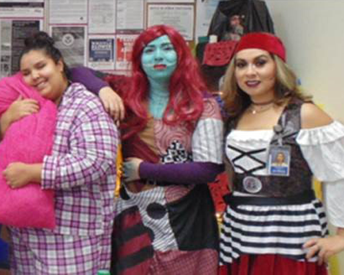 CyraCom employees in Halloween costumes