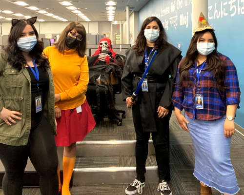 CyraCom employees dressed in costumes for Halloween