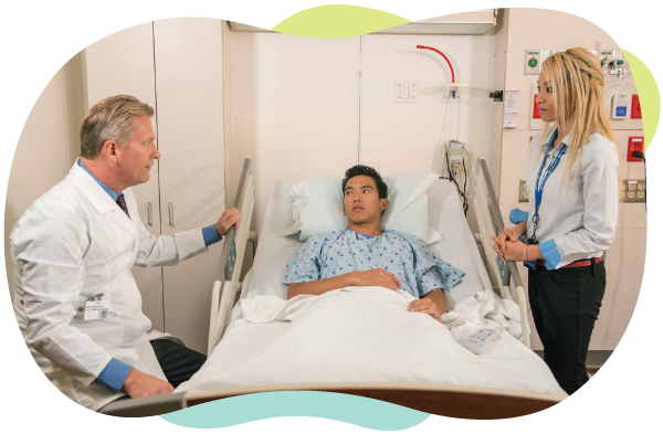 doctor speaks to hospital patient with interpreter